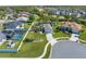 Aerial view of a single-Gathering home with a screened-in pool, surrounded by a well-manicured lawn at 3303 Ann Arbor Ct, St Cloud, FL 34772