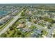 Aerial view of homes, green spaces, and proximity to nearby thoroughfare at 3303 Ann Arbor Ct, St Cloud, FL 34772