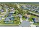 Aerial view of a home near a cul-de-sac with pool and mature landscaping at 3303 Ann Arbor Ct, St Cloud, FL 34772