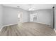 Spacious bedroom with neutral walls, wood-look flooring, and multiple doorways at 3303 Ann Arbor Ct, St Cloud, FL 34772