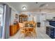 Dining area featuring wood table and chairs next to large glass china cabinet at 3303 Ann Arbor Ct, St Cloud, FL 34772