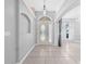 Bright foyer with neutral paint and tile flooring, offering a welcoming entrance to the home at 3303 Ann Arbor Ct, St Cloud, FL 34772