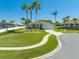 Well-kept home featuring a lush lawn and mature palm trees lining the curving driveway at 3303 Ann Arbor Ct, St Cloud, FL 34772