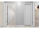 Bright hallway with white trim, tile flooring, and access to bathroom and bedroom at 3303 Ann Arbor Ct, St Cloud, FL 34772