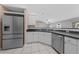 Kitchen featuring stainless steel appliances and a view into the living room at 3303 Ann Arbor Ct, St Cloud, FL 34772