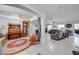 Spacious living room with decorative chandelier, piano, and multiple seating areas at 3303 Ann Arbor Ct, St Cloud, FL 34772