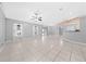 Bright living room featuring tile flooring, ample natural light, and neutral paint scheme at 3303 Ann Arbor Ct, St Cloud, FL 34772