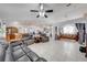 Spacious living room with tile floors connecting to kitchen and dining area at 3303 Ann Arbor Ct, St Cloud, FL 34772