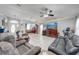 Bright, open-concept living room showcasing neutral tones, tile floors, and modern furnishings at 3303 Ann Arbor Ct, St Cloud, FL 34772
