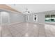 Spacious living space with tile floors and a view of the pool at 3303 Ann Arbor Ct, St Cloud, FL 34772