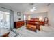 Main bedroom with hardwood furniture, a ceiling fan, and access to the screened-in patio at 3303 Ann Arbor Ct, St Cloud, FL 34772