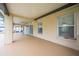 Covered outdoor patio with beige concrete, ceiling fan, and sliding glass door entrance to the house at 3303 Ann Arbor Ct, St Cloud, FL 34772