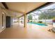 Expansive screened-in lanai area with beautiful pool, swing, and outdoor dining area at 3303 Ann Arbor Ct, St Cloud, FL 34772