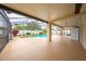 Spacious screened-in lanai with pool and adjacent outdoor entertaining space at 3303 Ann Arbor Ct, St Cloud, FL 34772
