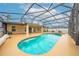 Large screened-in pool with jacuzzi and patio at 3303 Ann Arbor Ct, St Cloud, FL 34772