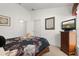 Bedroom featuring a bed, closet, dresser, and decorative mirror at 366 Highgate Park Blvd, Davenport, FL 33897