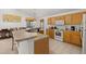 Bright kitchen featuring tile floors and lots of counter space, and white appliances at 366 Highgate Park Blvd, Davenport, FL 33897