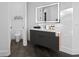 Modern bathroom featuring floating vanity and toilet at 3720 Kissimmee Park Rd, St Cloud, FL 34772