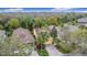 Aerial view of home showing mature trees and backyard, with a glimpse of the surrounding neighborhood at 412 Grand Canal Dr, Kissimmee, FL 34759