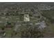 Aerial view of a home nestled in a wooded community with a defined property line at 425 S 12Th St, Lake Wales, FL 33853