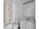 Updated bathroom with a shower-tub combo, tile walls, and modern fixtures at 425 S 12Th St, Lake Wales, FL 33853