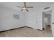 A cozy bedroom featuring fresh paint and modern wood-look flooring at 425 S 12Th St, Lake Wales, FL 33853