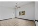 A clean and open bedroom with a ceiling fan and large window at 425 S 12Th St, Lake Wales, FL 33853