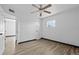 A cozy bedroom with wood-look floors and a ceiling fan providing a comfortable ambiance at 425 S 12Th St, Lake Wales, FL 33853