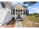 Inviting front entrance features a covered porch, screen door, and walkway to the home's entrance at 425 S 12Th St, Lake Wales, FL 33853
