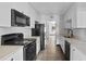 The kitchen features modern appliances, white cabinetry, and stone countertops at 425 S 12Th St, Lake Wales, FL 33853