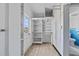 Functional storage room with shelving, ample space, and convenient access to the backyard at 425 S 12Th St, Lake Wales, FL 33853