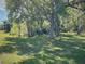 Secluded backyard with mature trees, offering privacy and natural beauty at 4602 Cumbrian Lakes Dr, Kissimmee, FL 34746