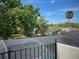 A serene backyard view from the upper floor, overlooking the screened pool and lush green landscape at 4602 Cumbrian Lakes Dr, Kissimmee, FL 34746