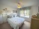 Comfortable bedroom featuring nautical themed decor and a view of the outdoors at 4602 Cumbrian Lakes Dr, Kissimmee, FL 34746