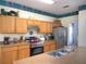 Well-equipped kitchen featuring stainless steel appliances, a breakfast bar, and ample counter space at 4602 Cumbrian Lakes Dr, Kissimmee, FL 34746