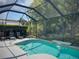 Beautiful pool with waterfall feature and lush landscaping at 4602 Cumbrian Lakes Dr, Kissimmee, FL 34746