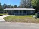 Single-story home with a carport and screened-in porch in a residential neighborhood at 4625 Weston Rd, Bartow, FL 33830