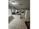 Spacious eat-in kitchen featuring white cabinetry, neutral countertops, and tile floors at 4625 Weston Rd, Bartow, FL 33830