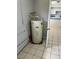 This room features a water heater, concrete block walls, and tiled flooring at 4625 Weston Rd, Bartow, FL 33830