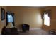 Inviting living room features ample natural light, tile flooring, and neutral paint at 516 Brentford Ct, Kissimmee, FL 34758
