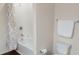Bathroom featuring a shower-tub combo, granite countertop, and modern fixtures and fixtures at 5364 Diplomat Ct # 106, Kissimmee, FL 34746