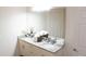 Bright bathroom features granite countertops, double sinks, and a decorative plant at 5364 Diplomat Ct # 106, Kissimmee, FL 34746