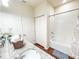 Bathroom featuring a shower-tub combo, granite countertop, and white vanity with storage at 5364 Diplomat Ct # 106, Kissimmee, FL 34746