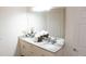 Bright bathroom features granite countertops, double sinks, and a decorative plant at 5364 Diplomat Ct # 106, Kissimmee, FL 34746