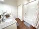 Bathroom with granite counter, shower and tub with modern fixtures at 5364 Diplomat Ct # 106, Kissimmee, FL 34746