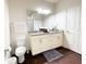 Bathroom featuring a double vanity, granite countertop, and modern fixtures and fixtures at 5364 Diplomat Ct # 106, Kissimmee, FL 34746