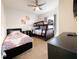 Comfortable bedroom featuring twin bed, bunk beds, and a ceiling fan at 5364 Diplomat Ct # 106, Kissimmee, FL 34746