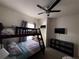 Bedroom featuring bunk beds, ceiling fan, flat screen TV, and neutral carpet at 5364 Diplomat Ct # 106, Kissimmee, FL 34746