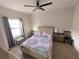 Well-lit bedroom featuring a ceiling fan, window, and comfortable bed setup at 5364 Diplomat Ct # 106, Kissimmee, FL 34746