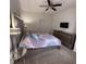 Bedroom with mirrored headboard, TV and a mirrored dresser at 5364 Diplomat Ct # 106, Kissimmee, FL 34746